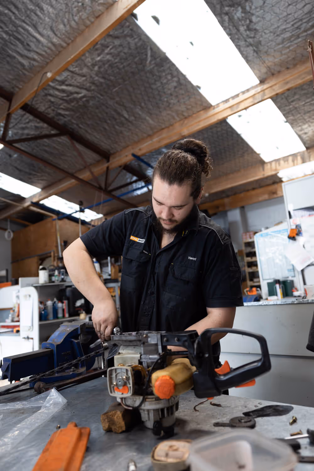Man servicing still equipment. 
