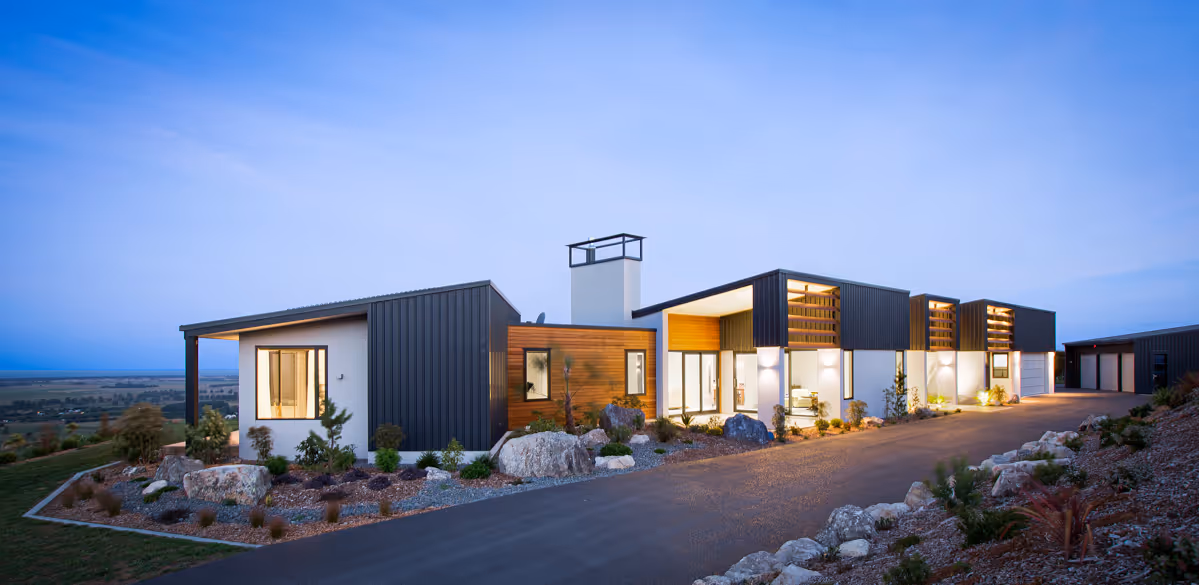 Home on a large piece of land in the evening. 