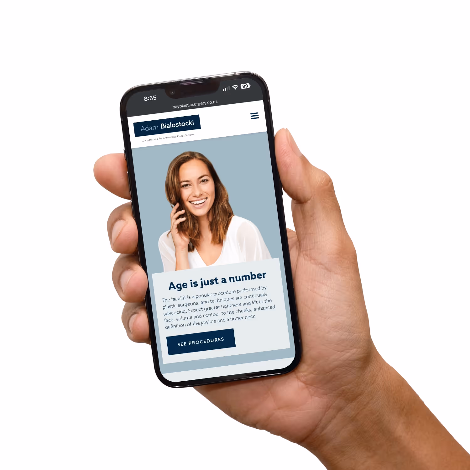 Hand holding mobile with website.