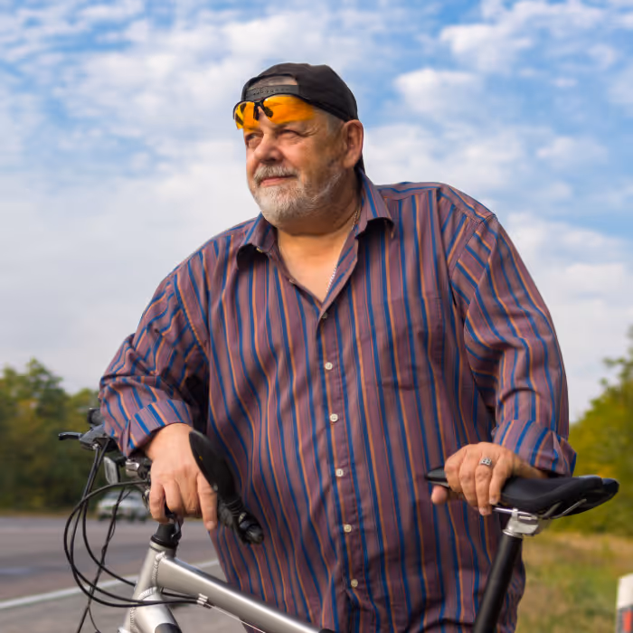 Overweight man with bike. 