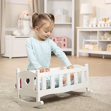 Girl playing with cot. 