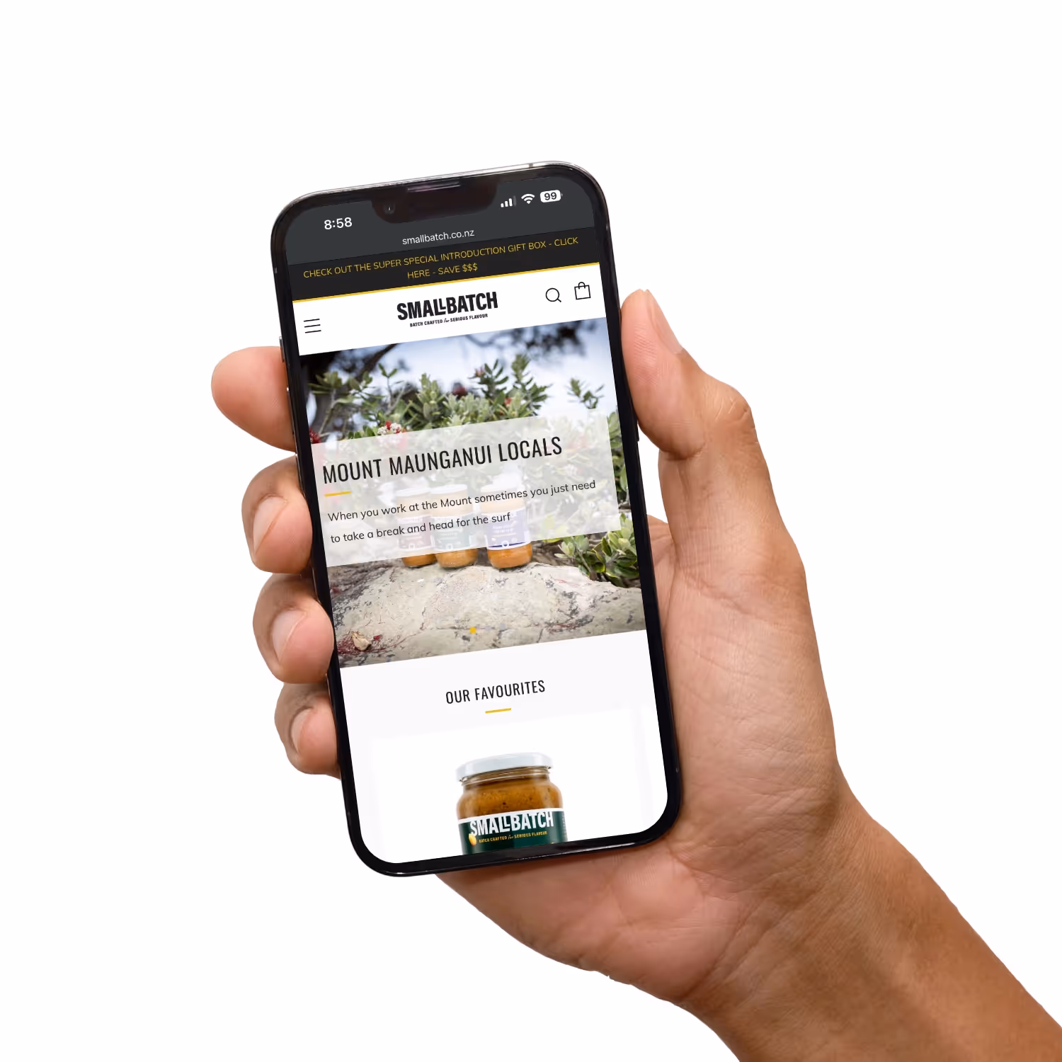 Hand holding mobile phone with website.