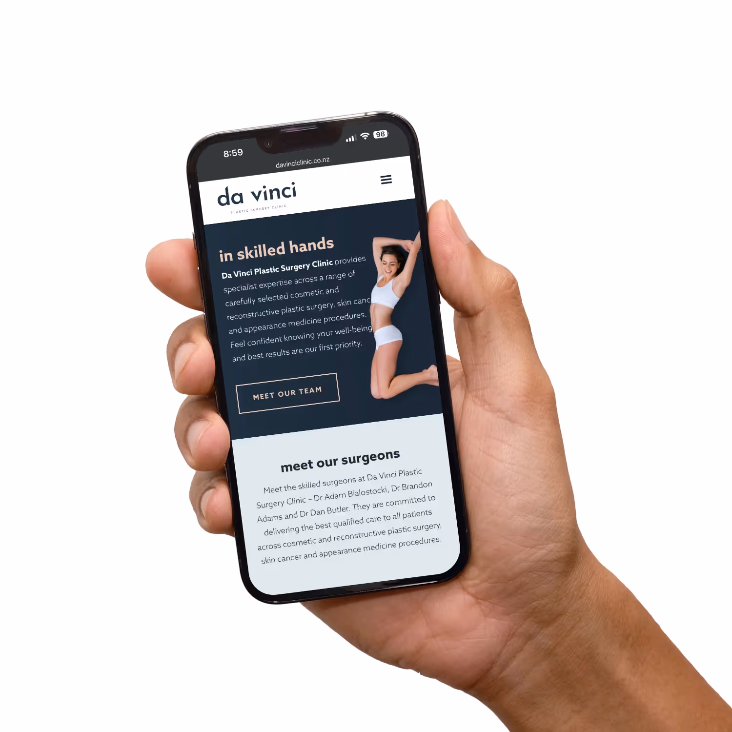 Hand holding mobile phone with website.