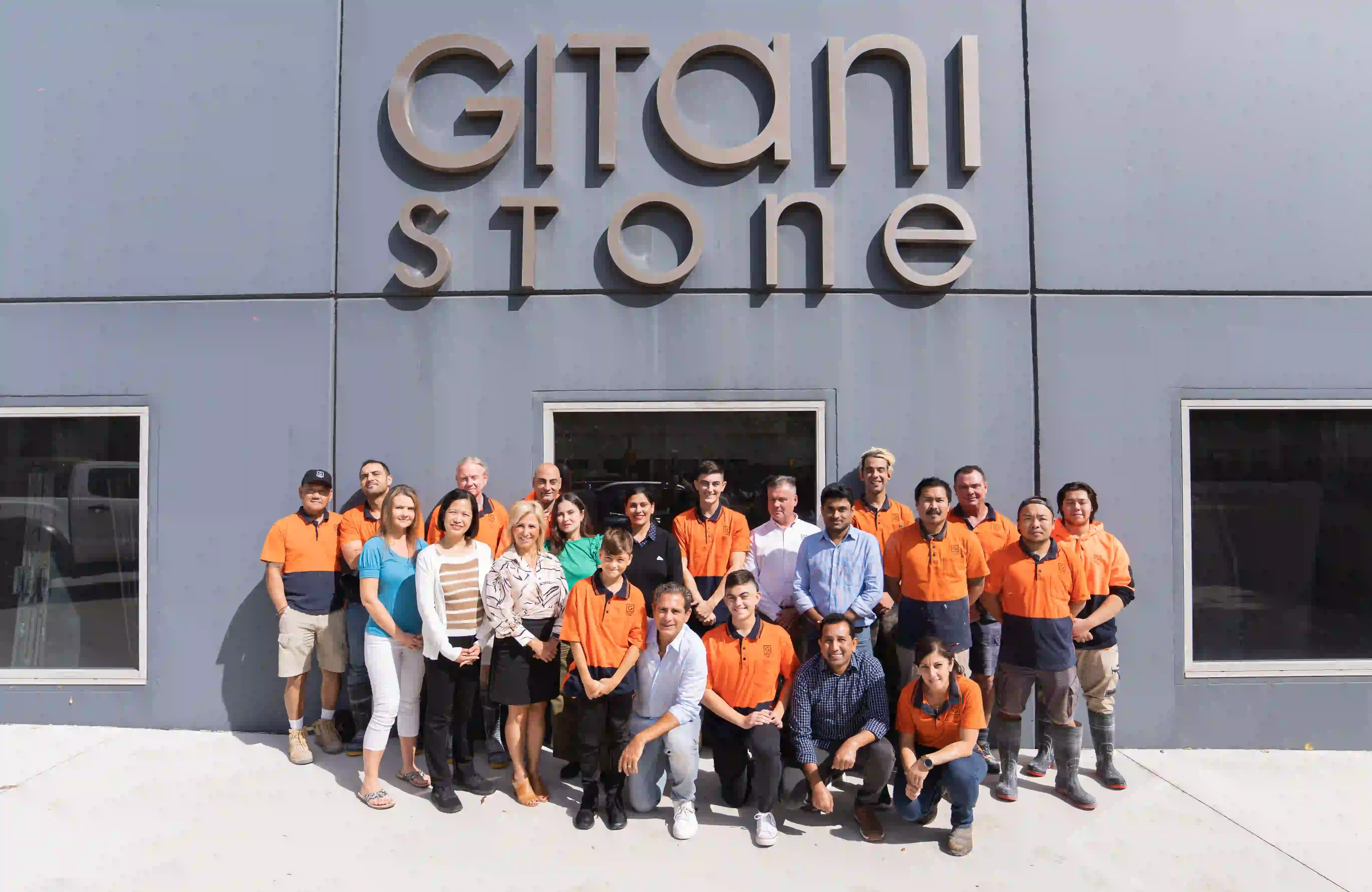 Gitani Stone employees standing in front of the Gitani Stone building