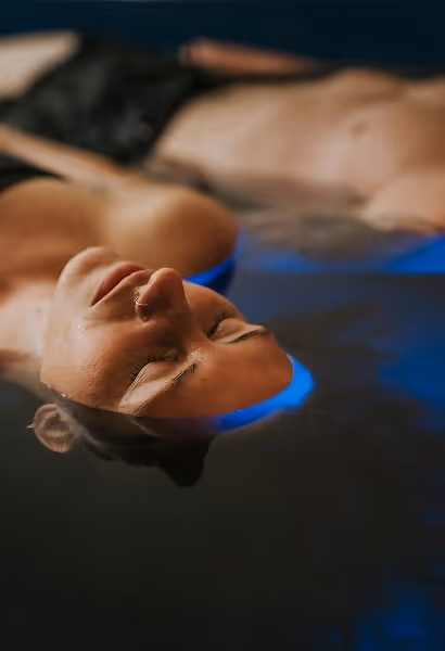 Women relaxing in Float Therapy treatment with head out of water