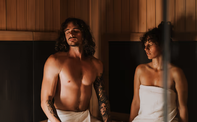 Man and women infrared sauna deep thinking eyes closed