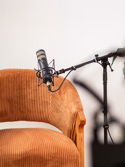 House of Alcheme Podcast Room empty chair with mic
