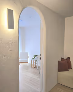 Arched door looking through waiting room