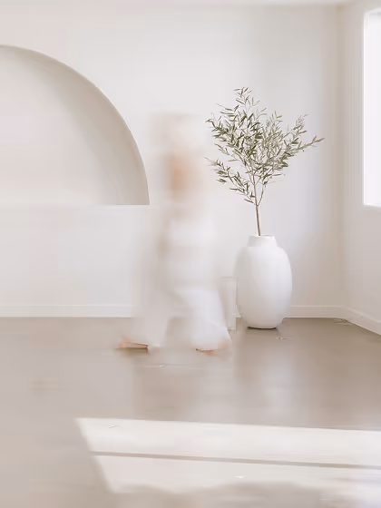 light event space with arched wall person blur