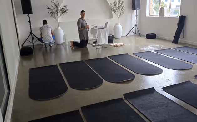 setting up a event space with black mats