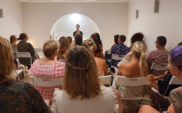 women speaks to a crowd of people
