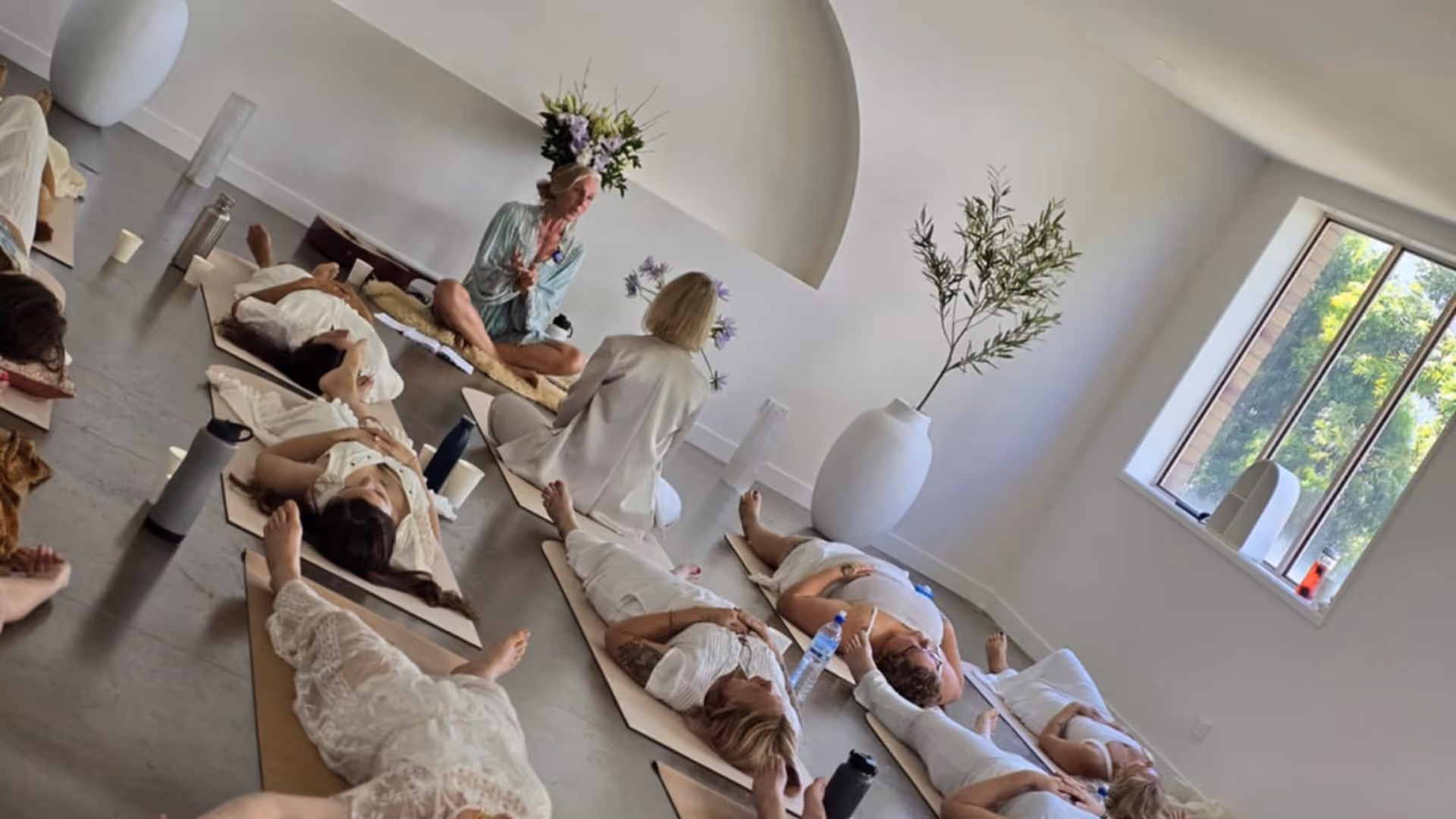 group of women lying on floor relaxing