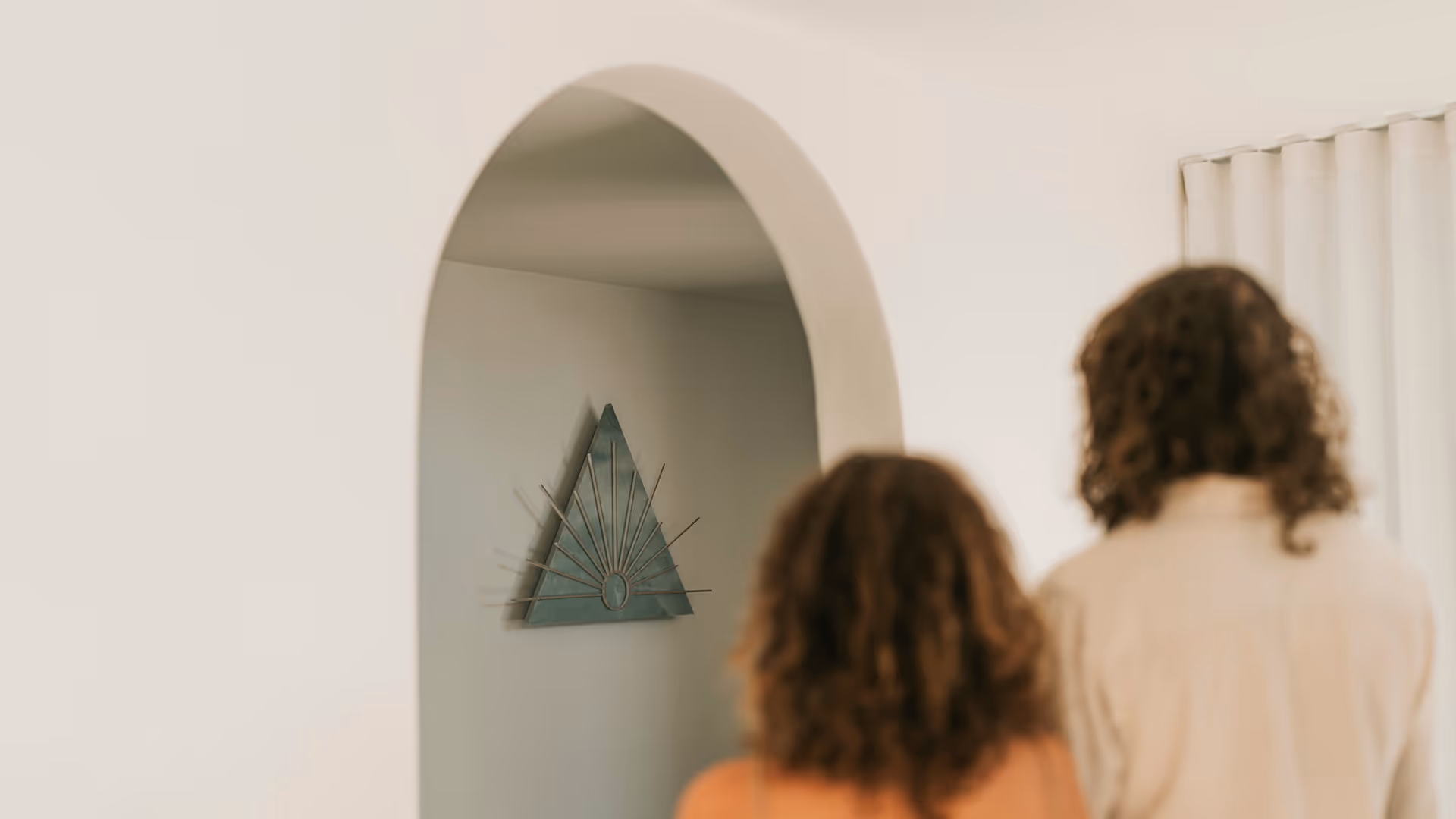 couple about to walk through arched door