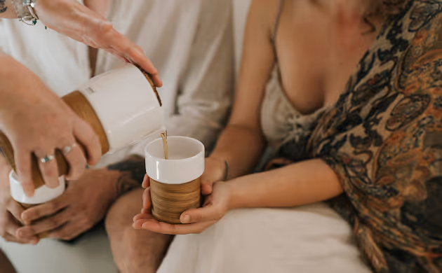 couple being served tea