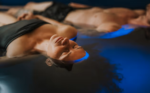 float therapy two people holding hands-1