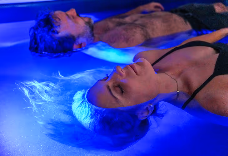 float therapy women and man relaxing in water