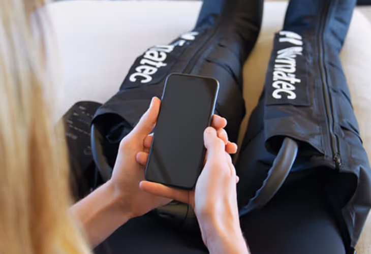 Lymphatic Massage Boots women using phone