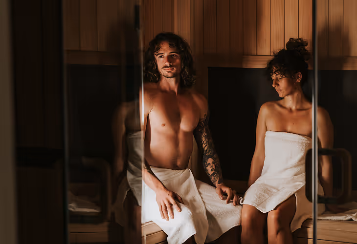 Infrared Sauna couple behind doors