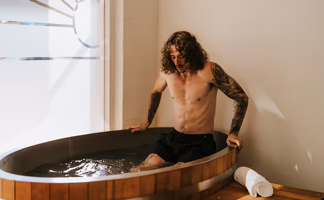 Contrast Therapy man getting in ice bath