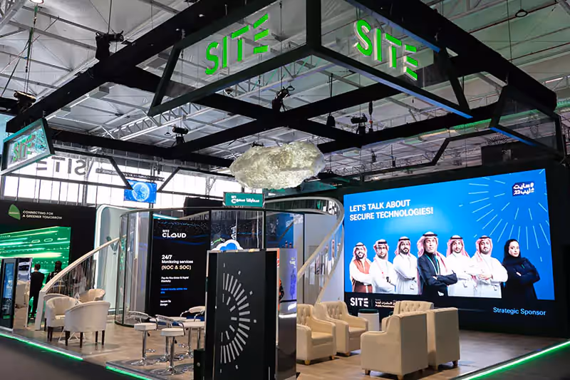 Exhibition stand with branded walls and lighting