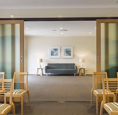 A funeral home with seating and a lounge area.