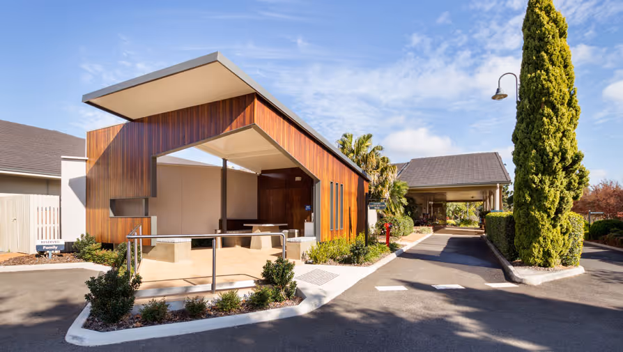 Modern funeral home exterior and gardens.
