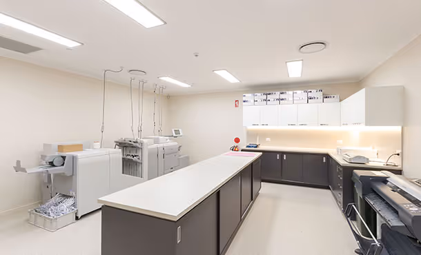 Utility room with printing and binding equipment.
