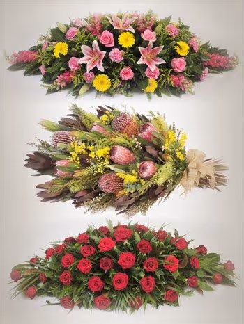 Three distinct floral arrangements for funerals.