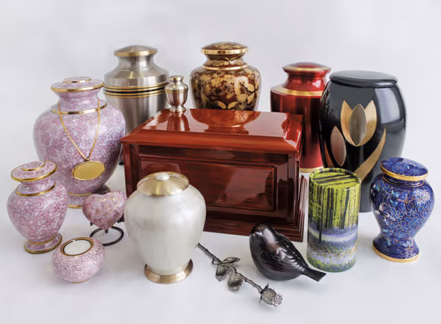 A collection of diverse funeral urns and keepsakes.