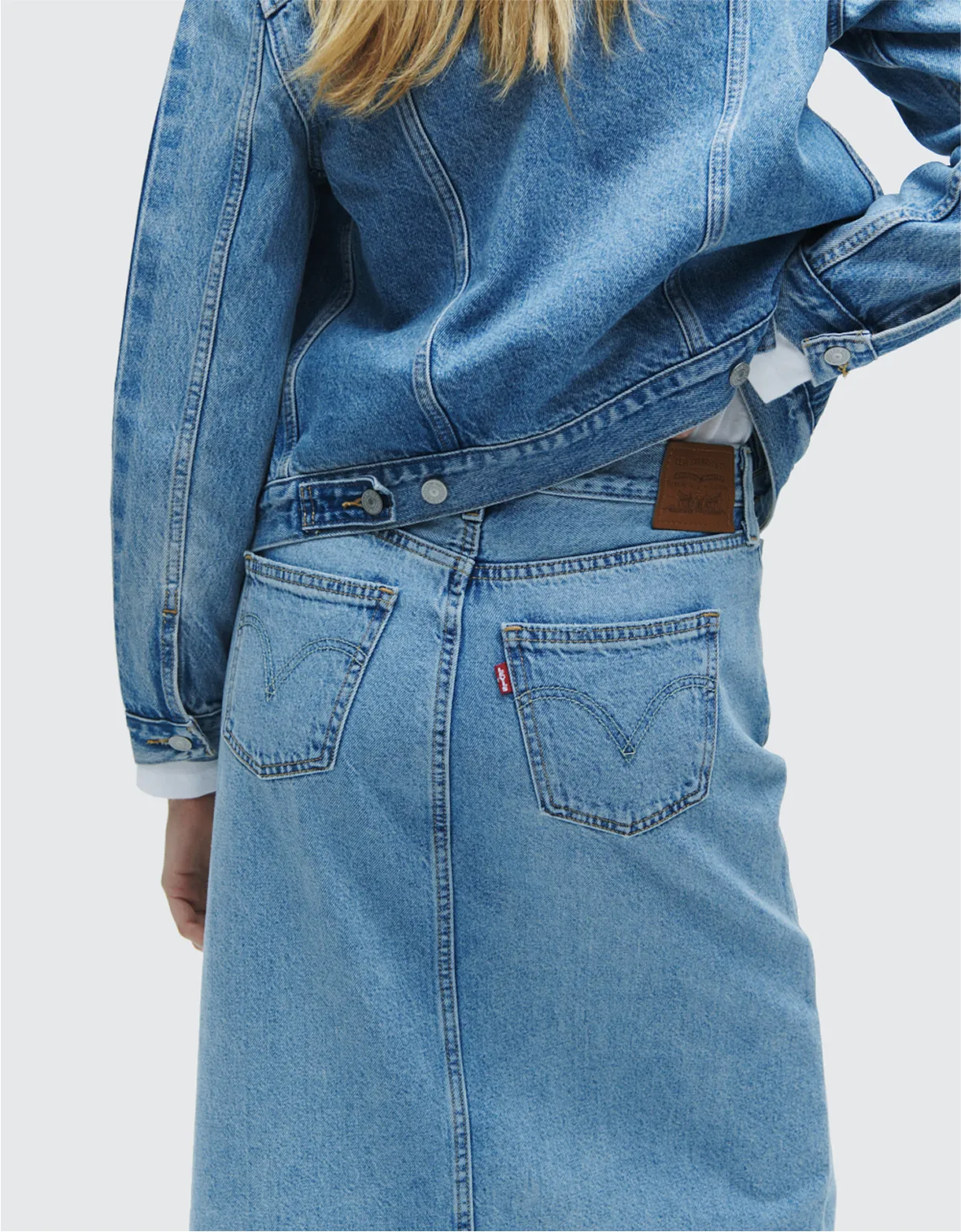 A woman wearing denim clothing