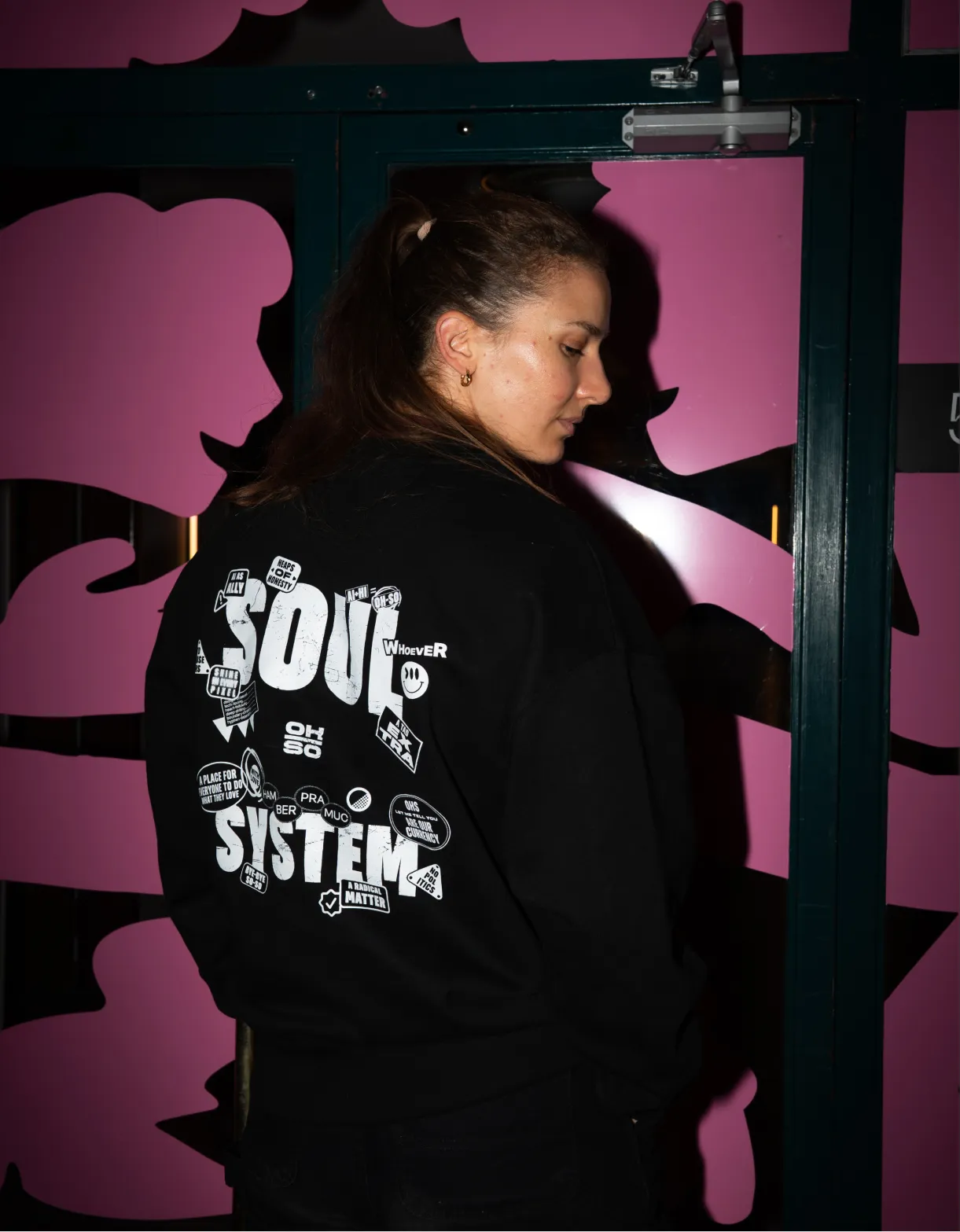 OH-SO team members showing the team sweaters in blue and black.