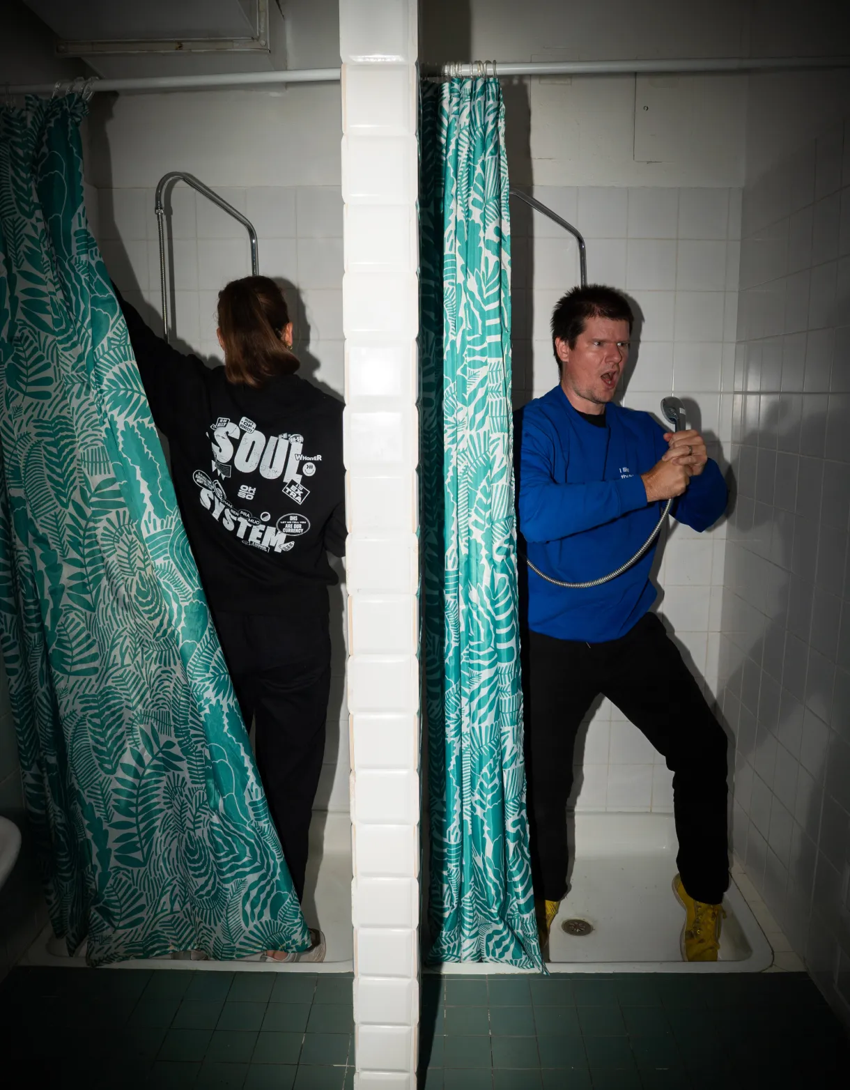 OH-SO team members showing the team sweaters in blue and black.