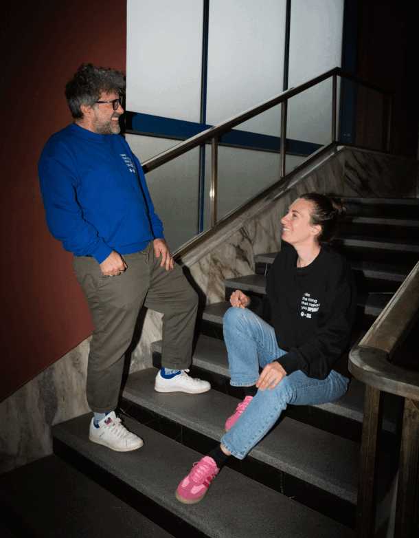 OH-SO team members showing the team sweaters in blue and black.