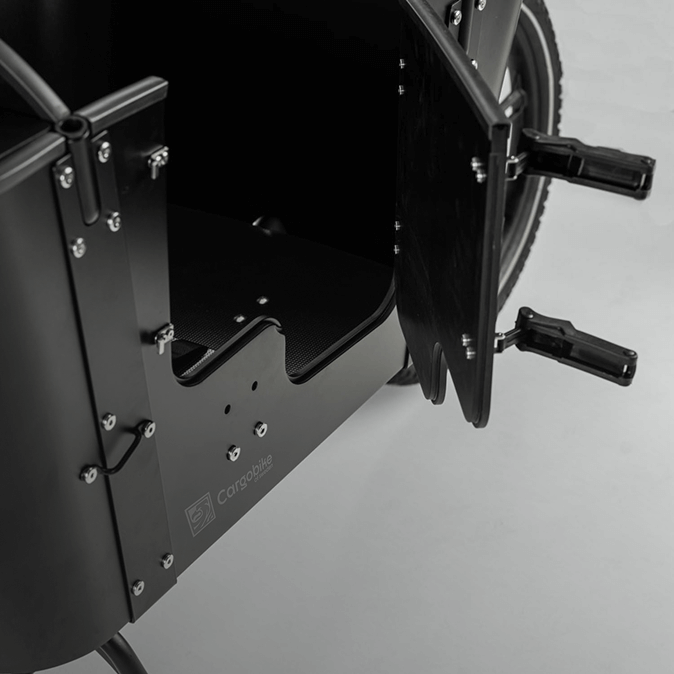 A black Cargobike with a door open