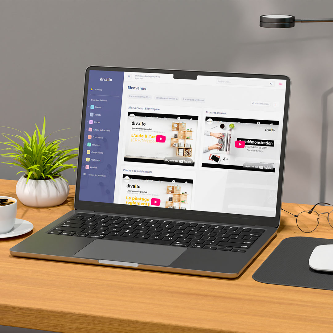 L’image présente un espace de travail épuré et contemporain, avec un ordinateur portable posé sur un bureau. L’écran affiche une interface web du site divalto