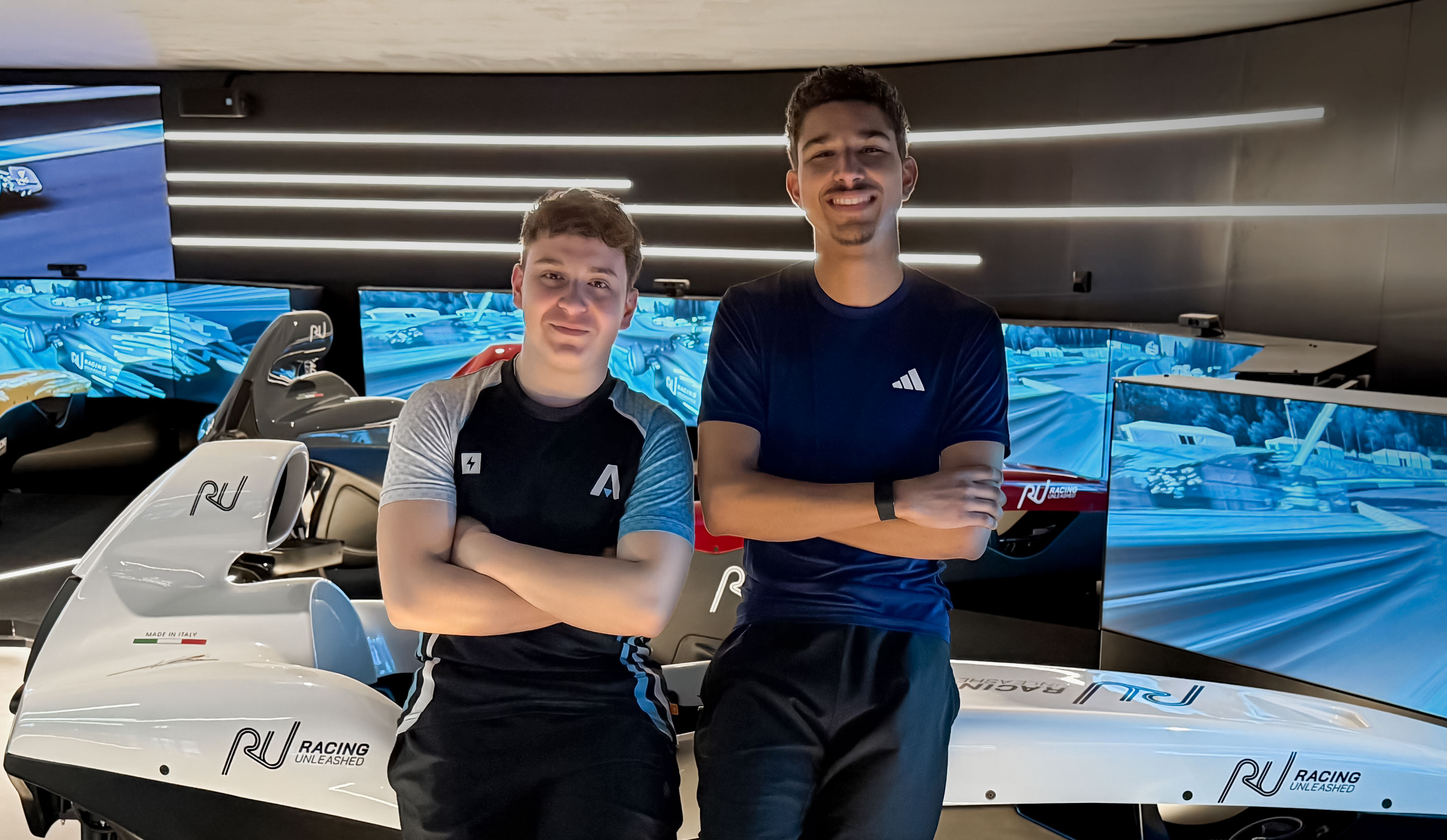 Jamie and Haris in front of the Racing Unleashed simulator