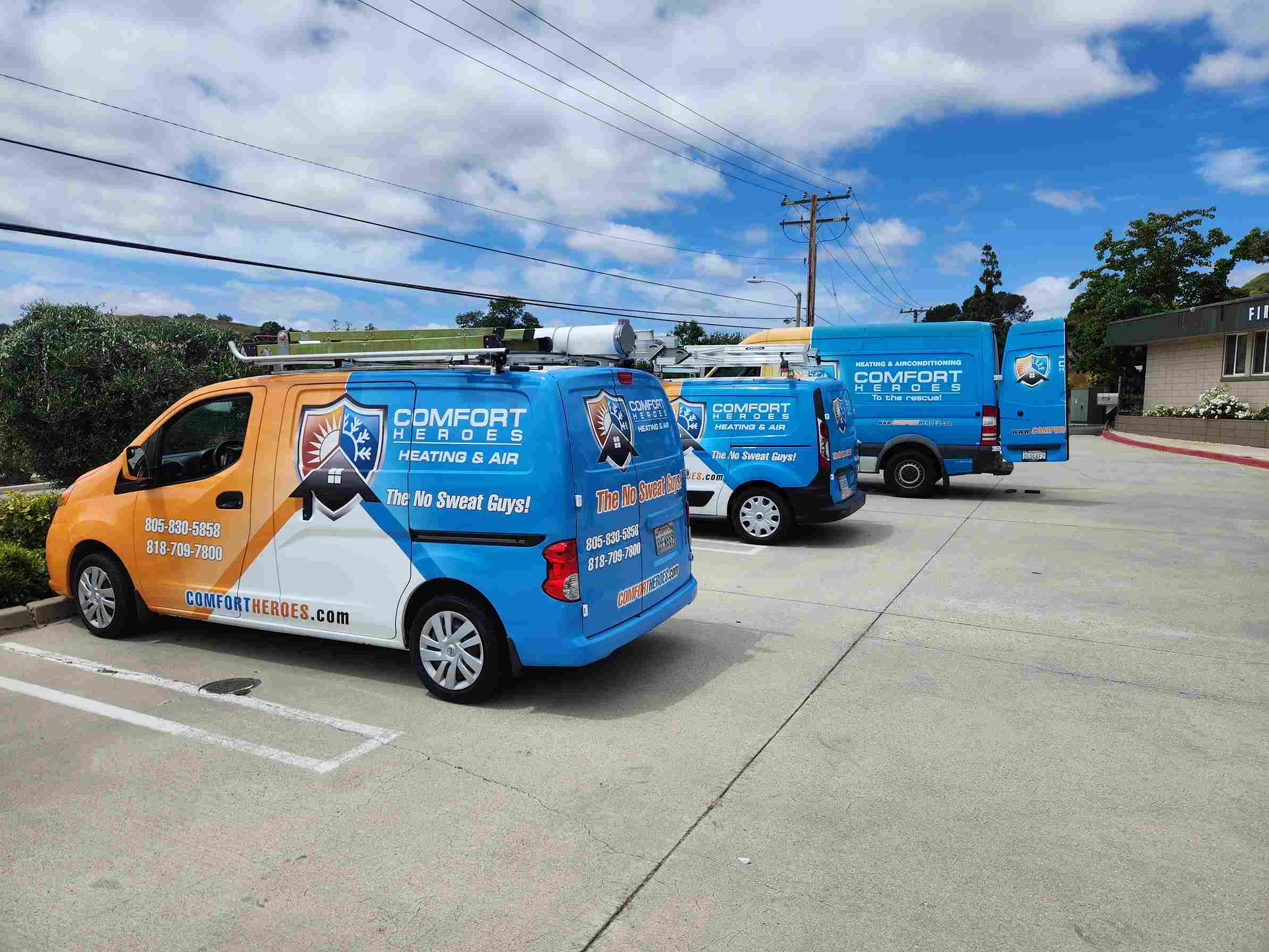 Person with glasses using smartphone near air conditioner and white brick wall