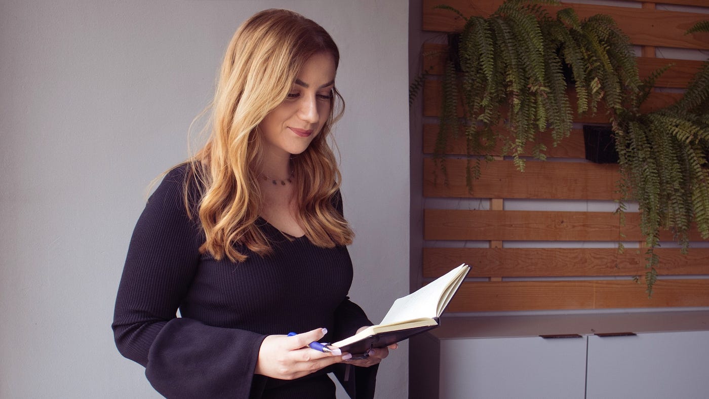 Professional woman studying a dictionary during work