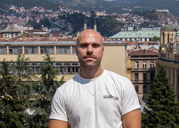Colleague posing confidently on an office terrace