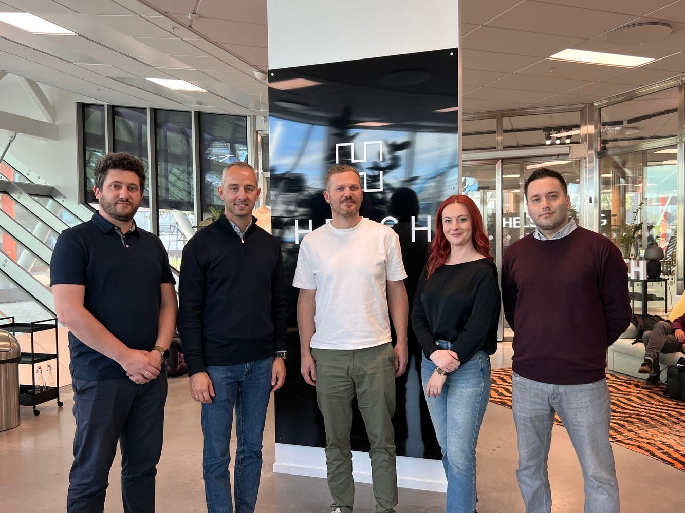 Team members taking a cheerful picture together at work