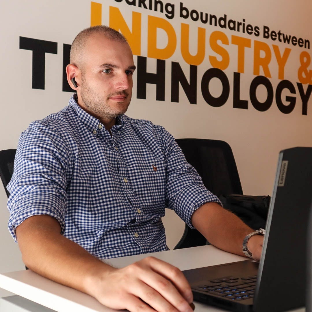 Colleague typing on a laptop during a work session