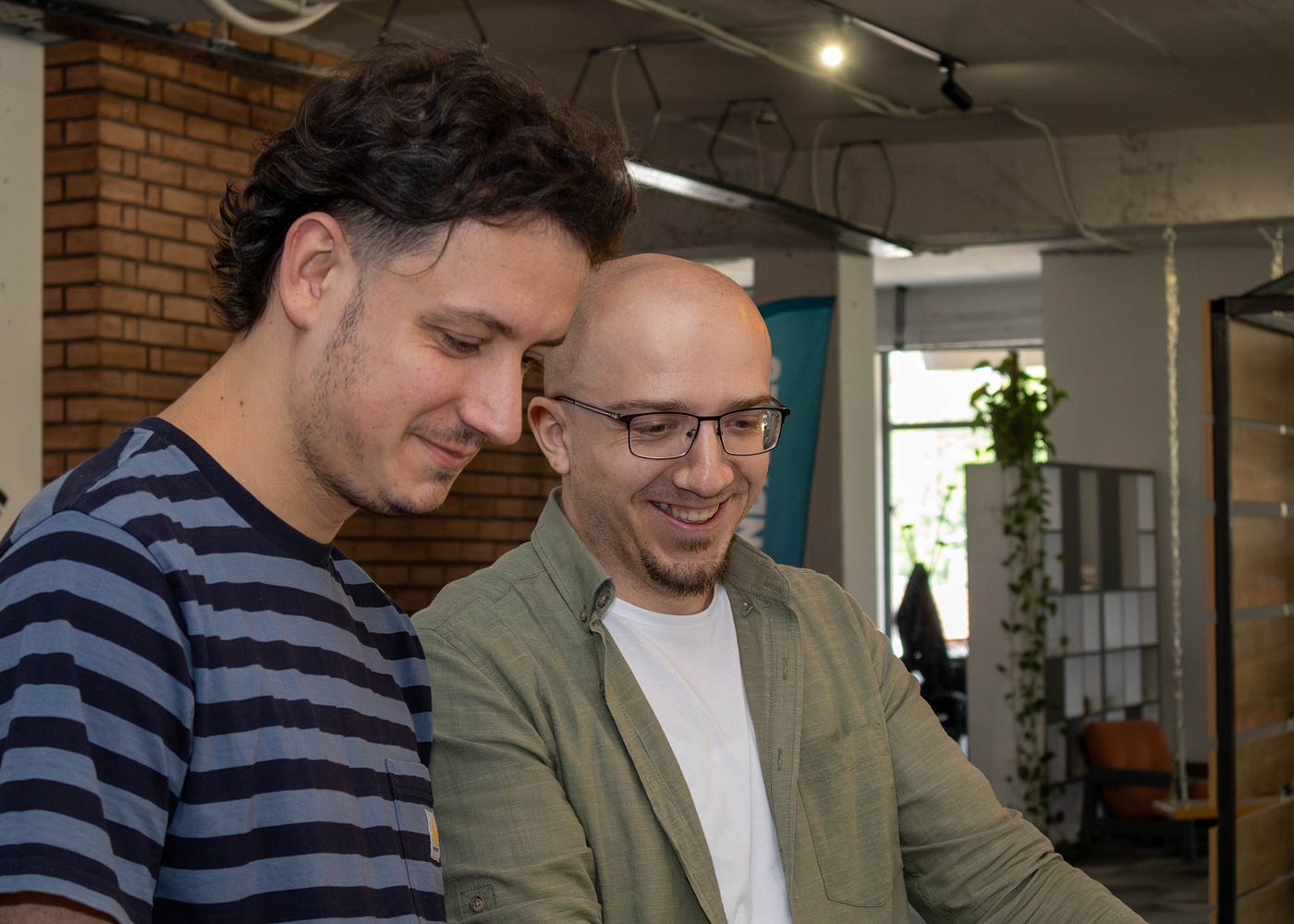 Professionals working side by side and smiling