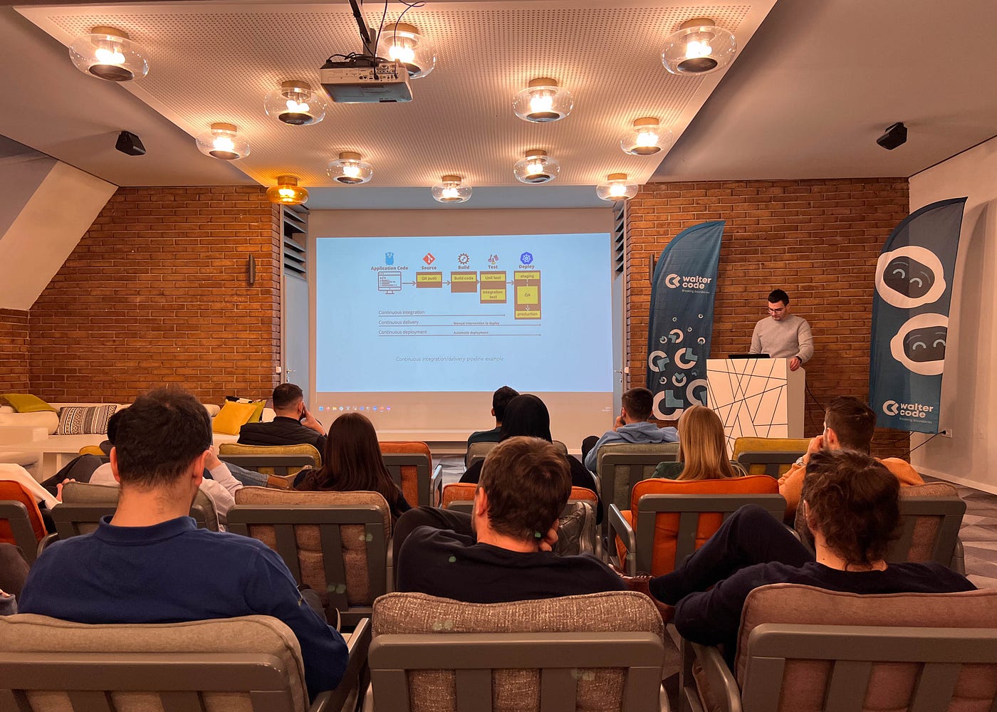 Colleague delivering a training session to a group of participants