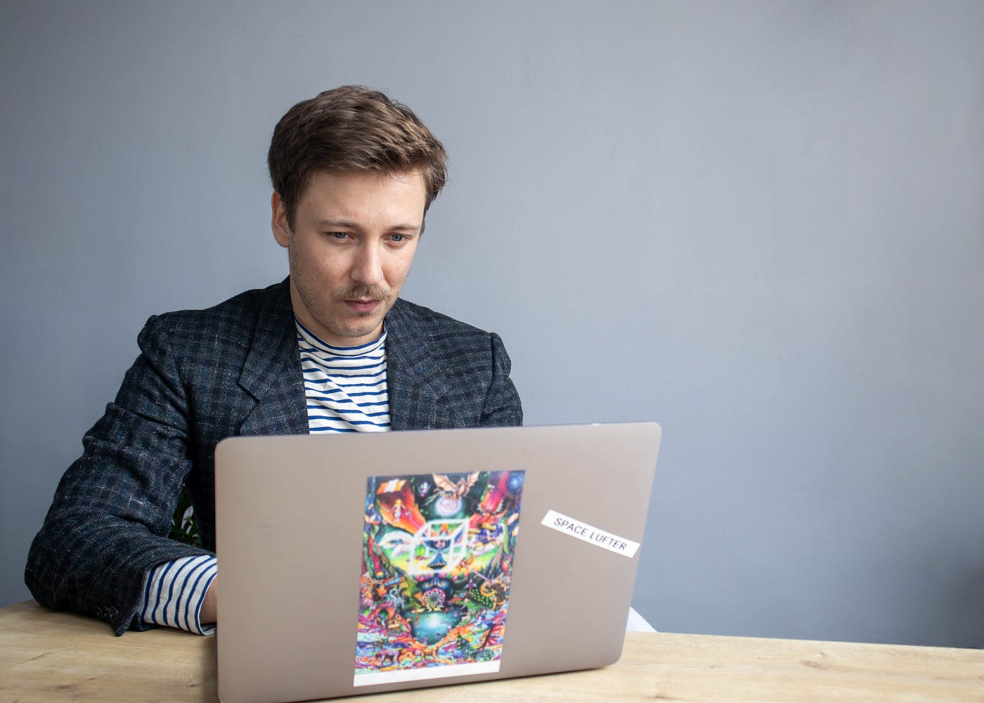 Man focused on working at his laptop in the office