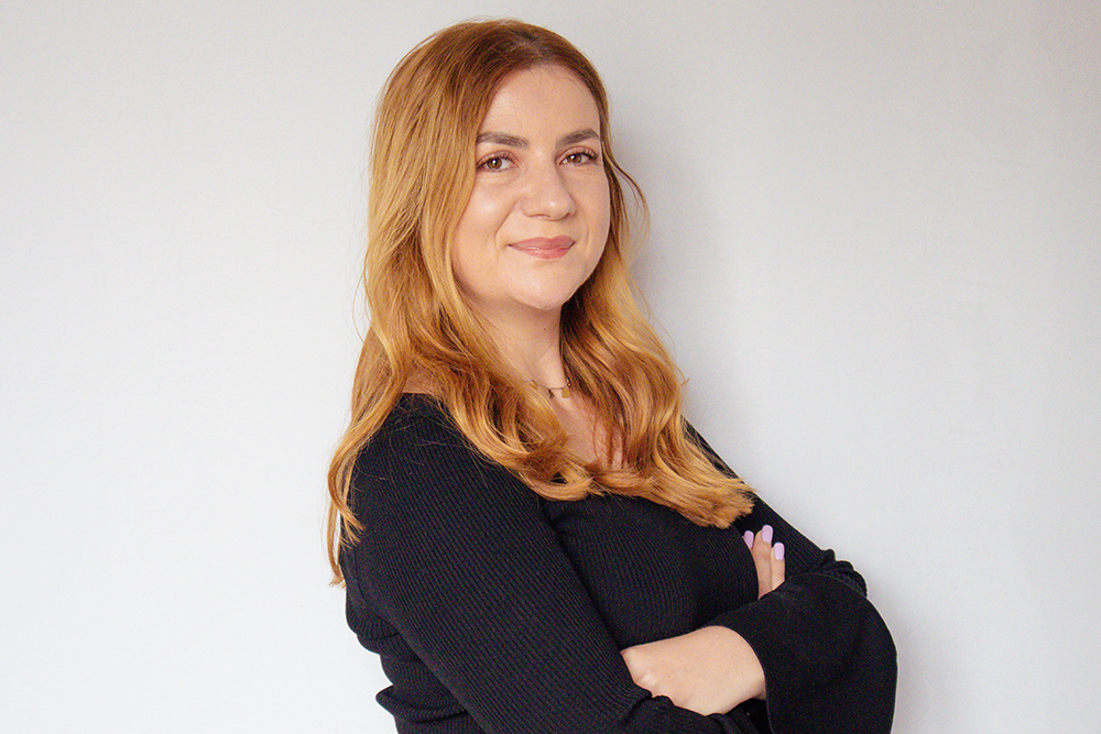 Woman posing confidently for a blog cover photo