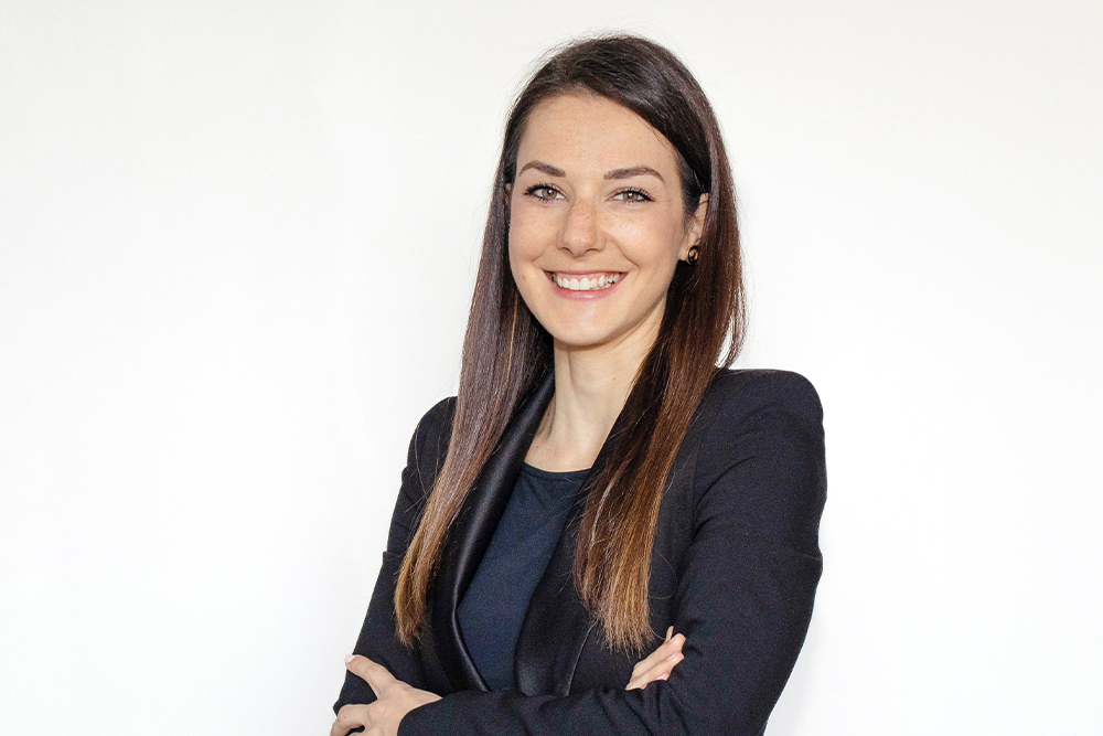 Professional woman standing and posing for a portrait photo