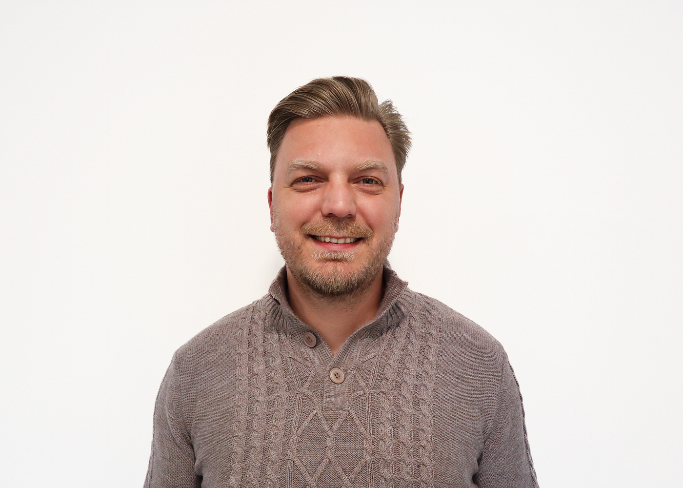 Portrait of a man looking at the camera with a friendly expression
