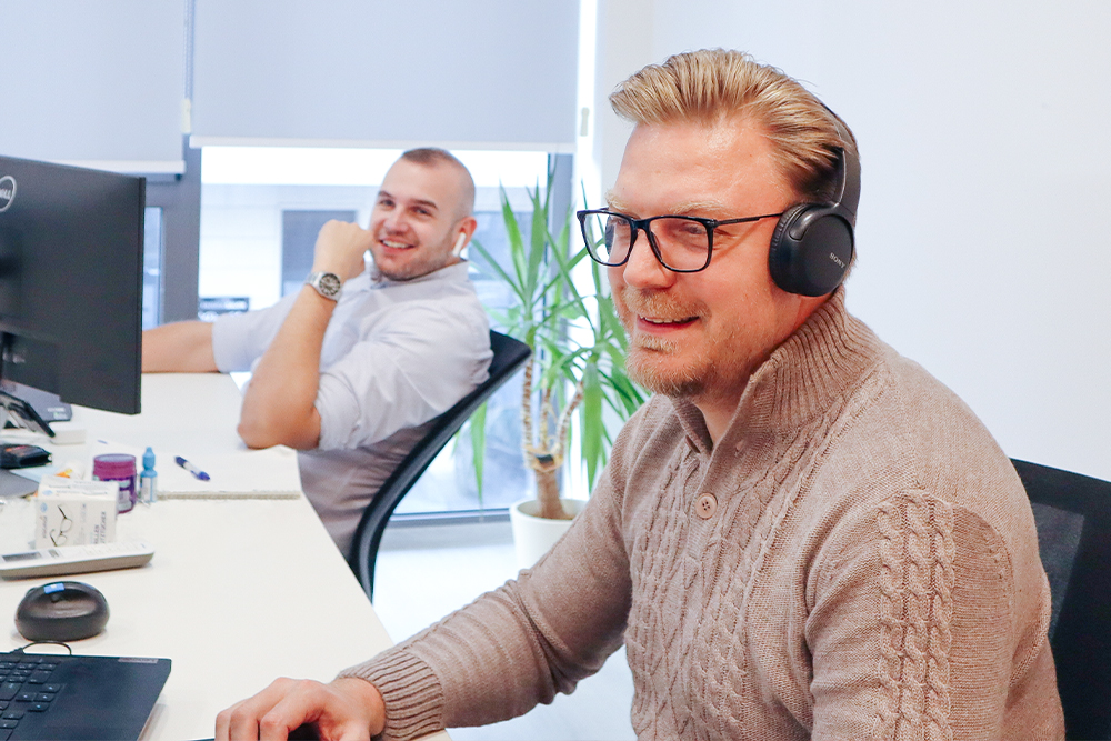 Colleague captured smiling in front of the camera for blog content