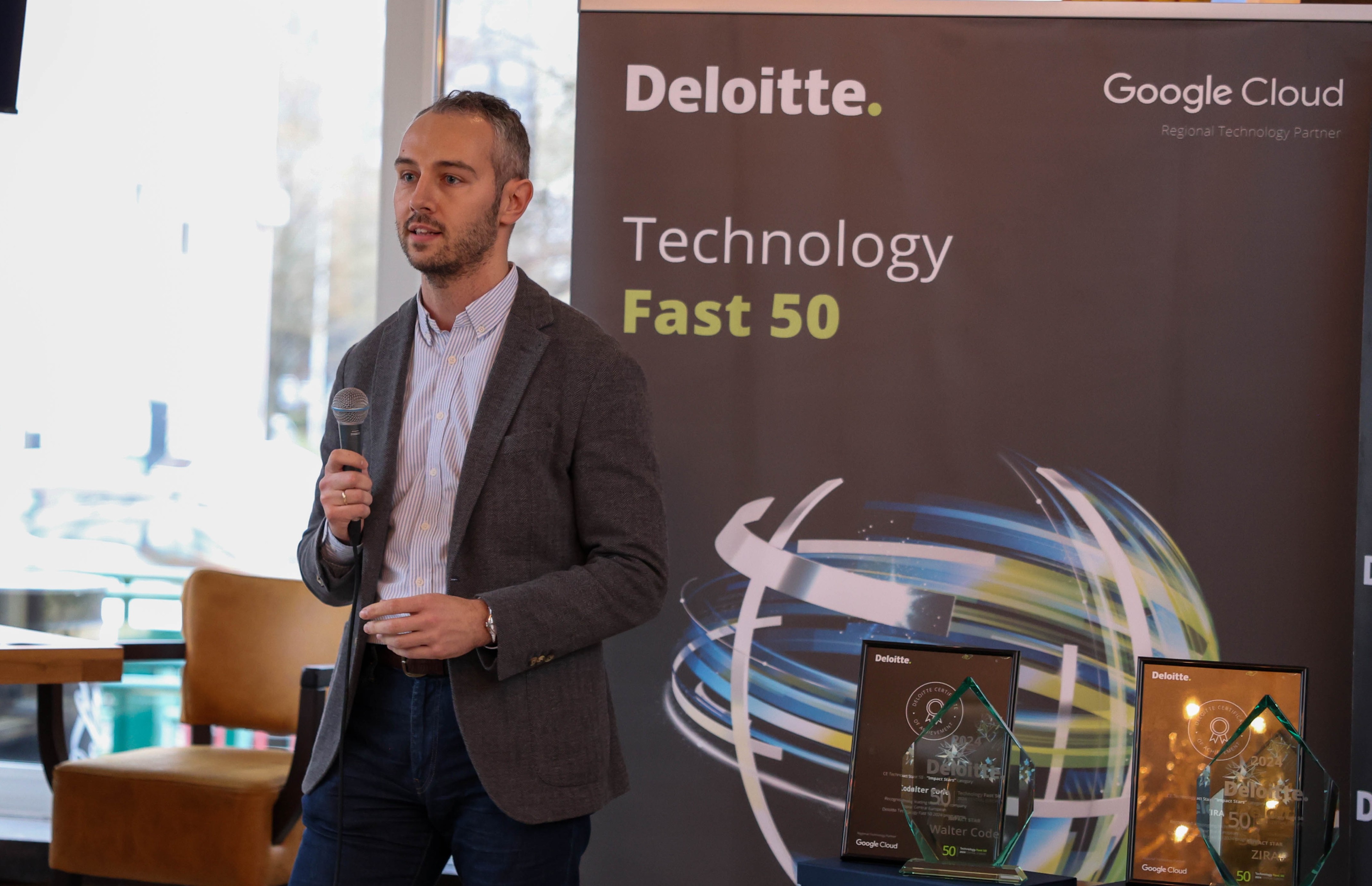 Colleague delivering a speech during a team meeting or event