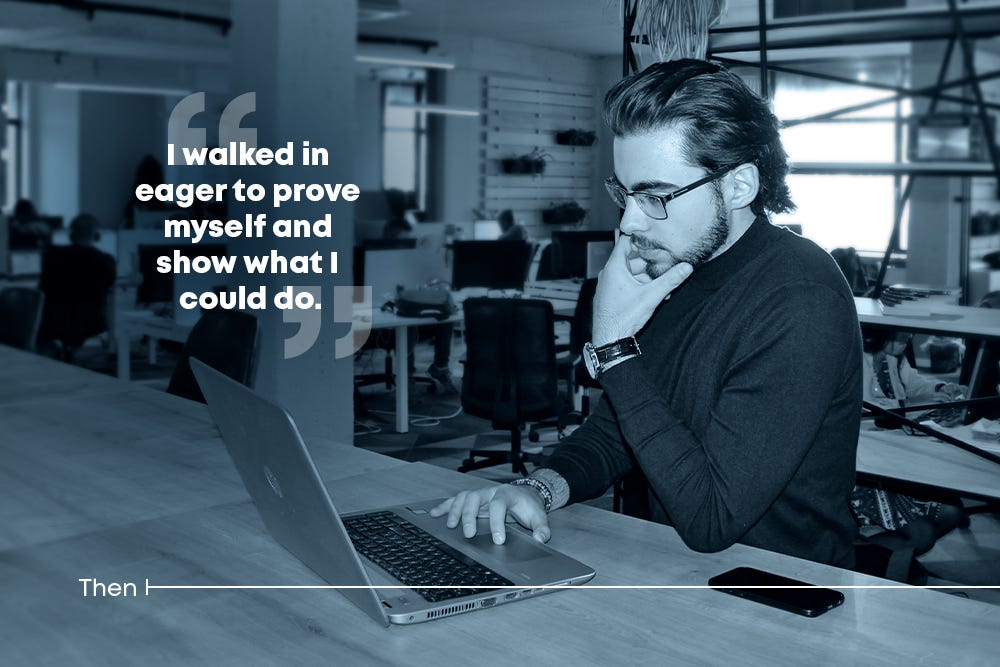 Man focused while working on a laptop in the office